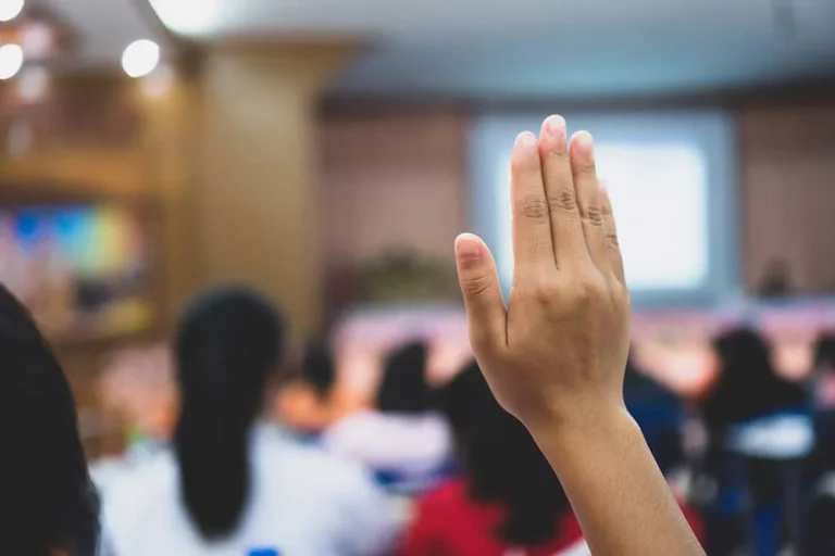 Hand raised in a classroom