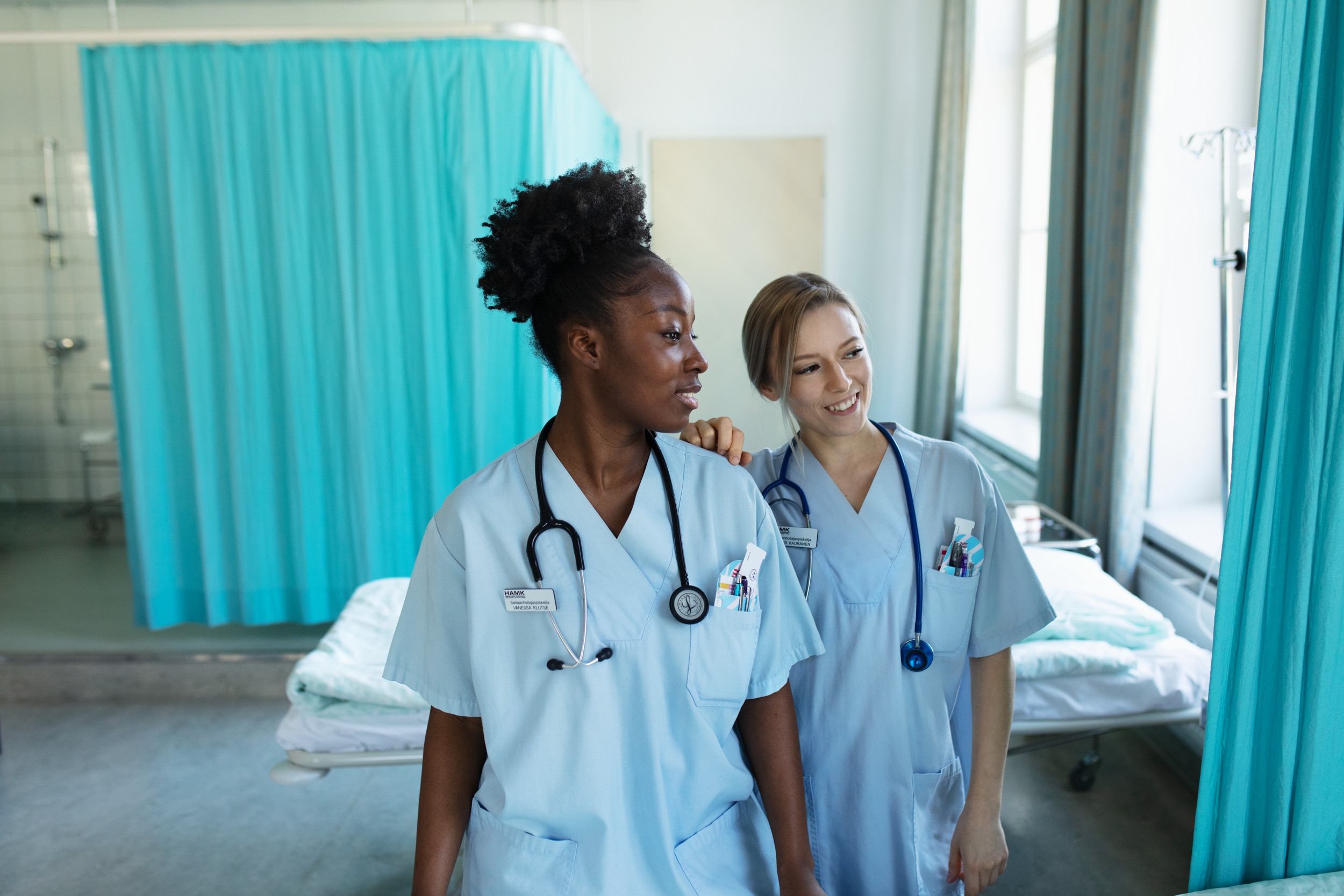 Two nurse students standing side-by-side.