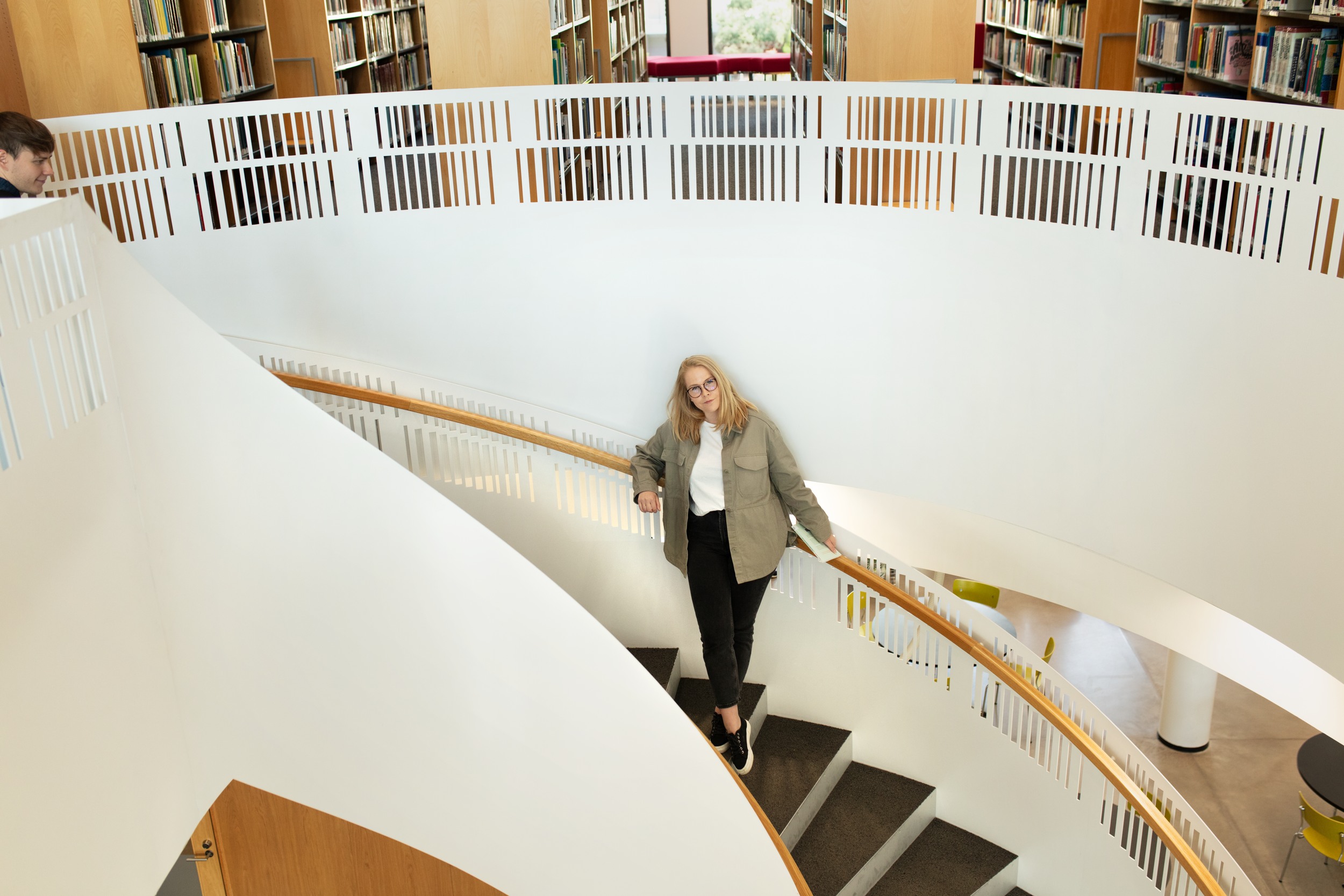 A woman standing in stairs