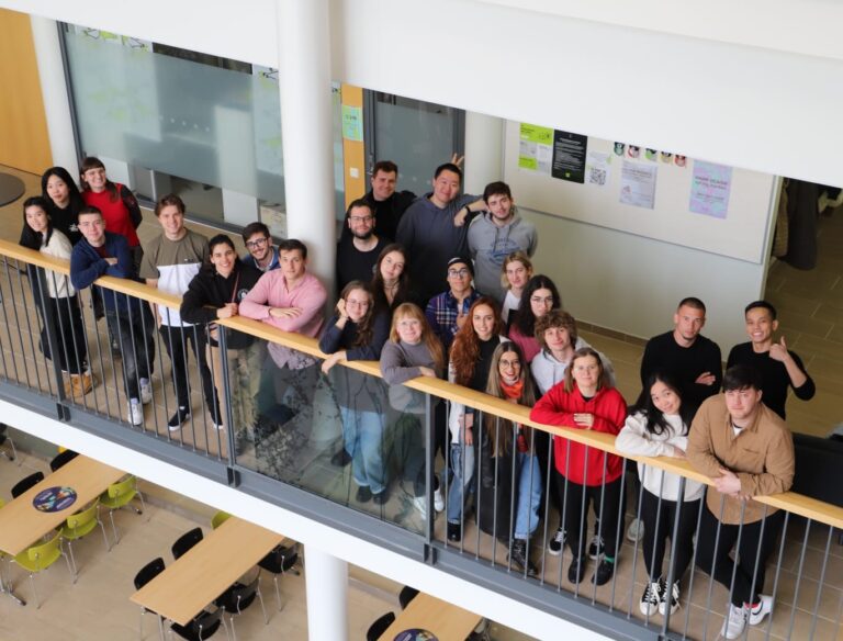 Group of students standing and smiling at HAMK