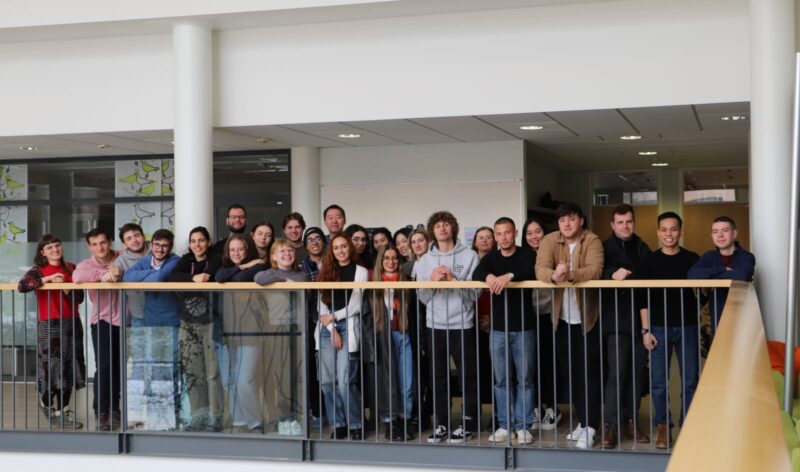 Group of students smiling and looking at camera