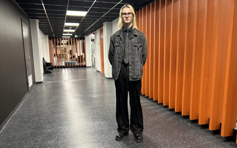 Student standing in a corridor