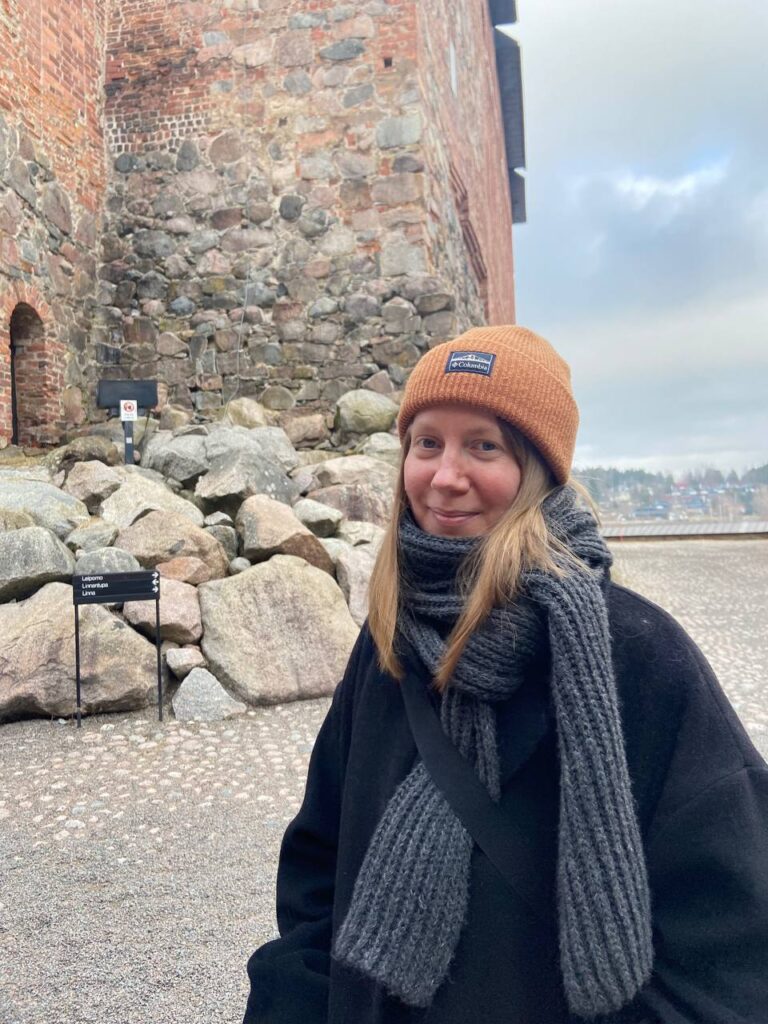Erika Matikainen in front of the Häme Castle