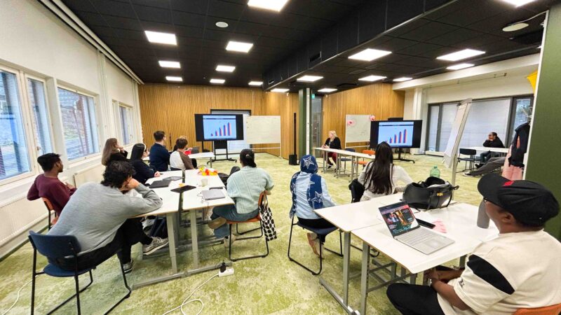 Business simulation classroom with students